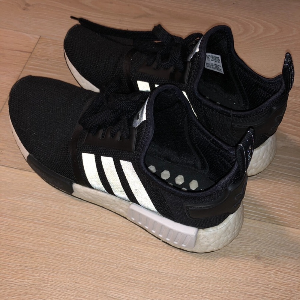 Black NMD R1 shows